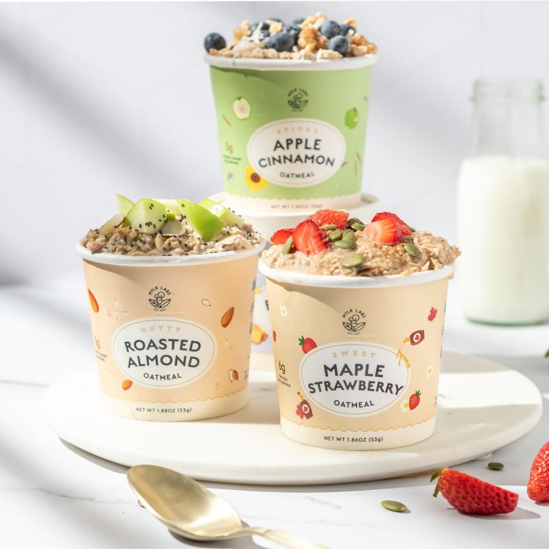 three oatmeal cups with fruit toppings