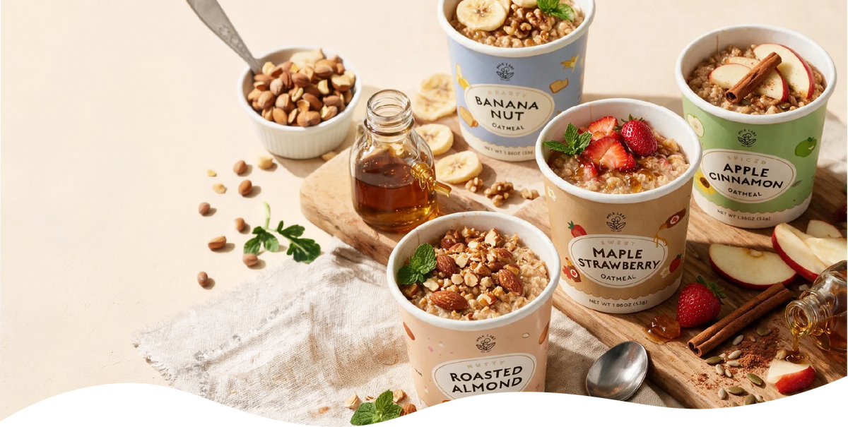 four mylk labs oatmeal cups cooked with toppings and fruit