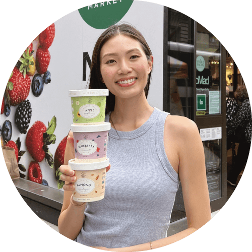 woman holding stack of oatmeal