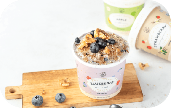 blueberry oatmeal with toppings on board