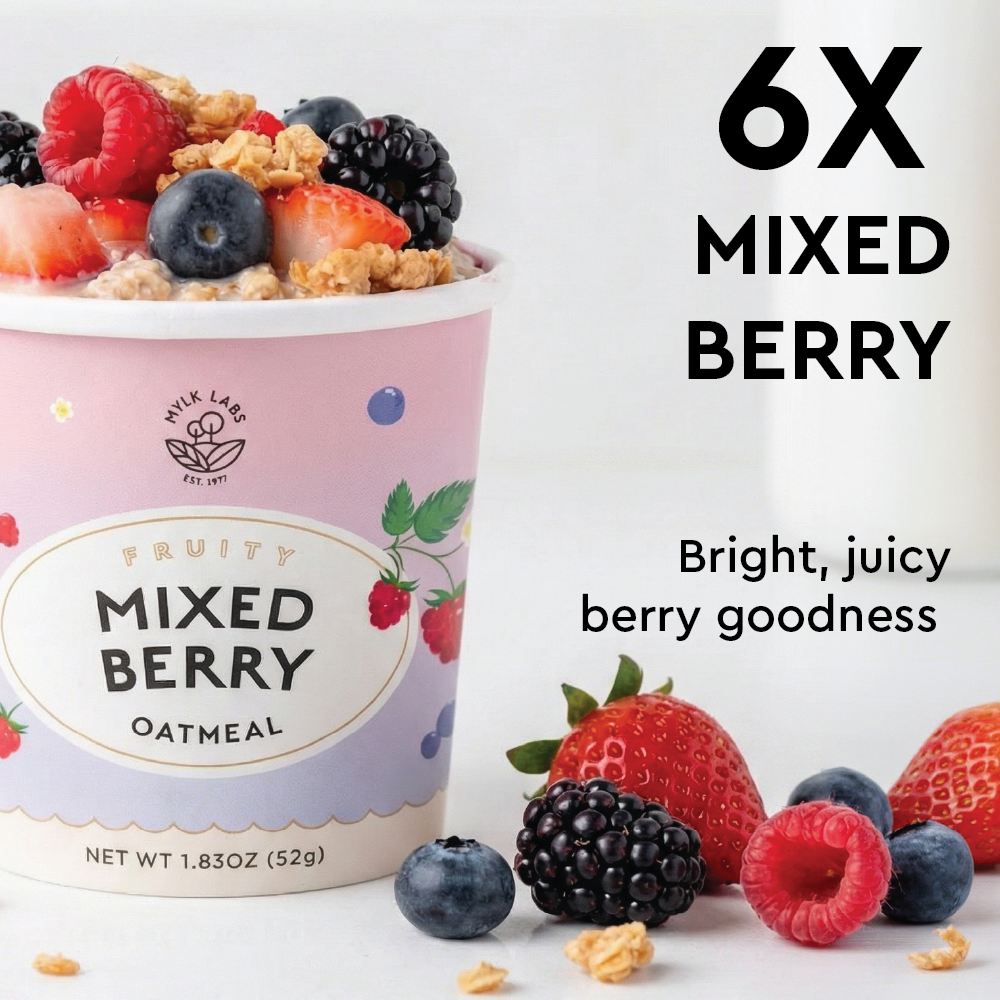 Container of mixed berry oatmeal with berries on a white background
