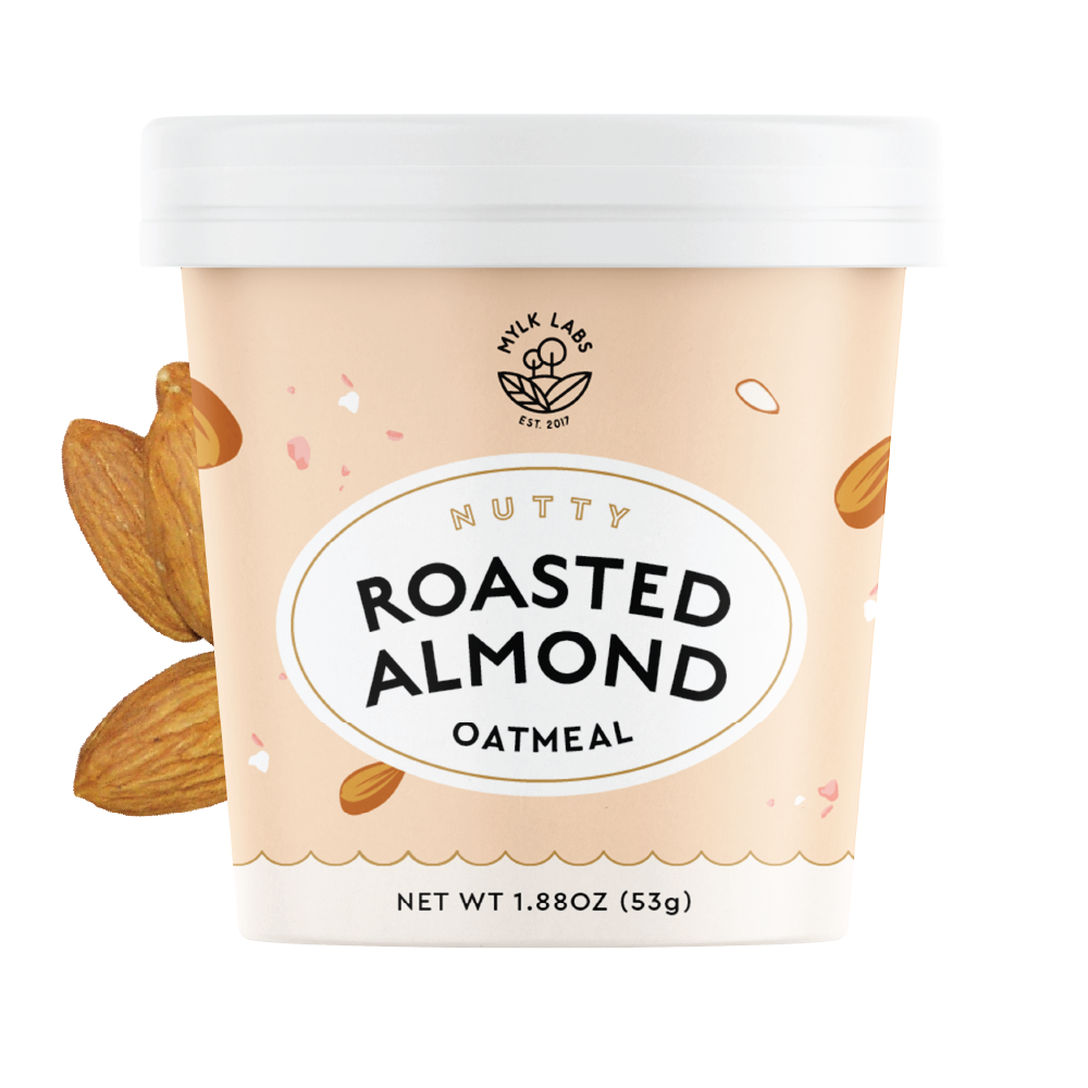Container of roasted almond oatmeal with almonds on a white background