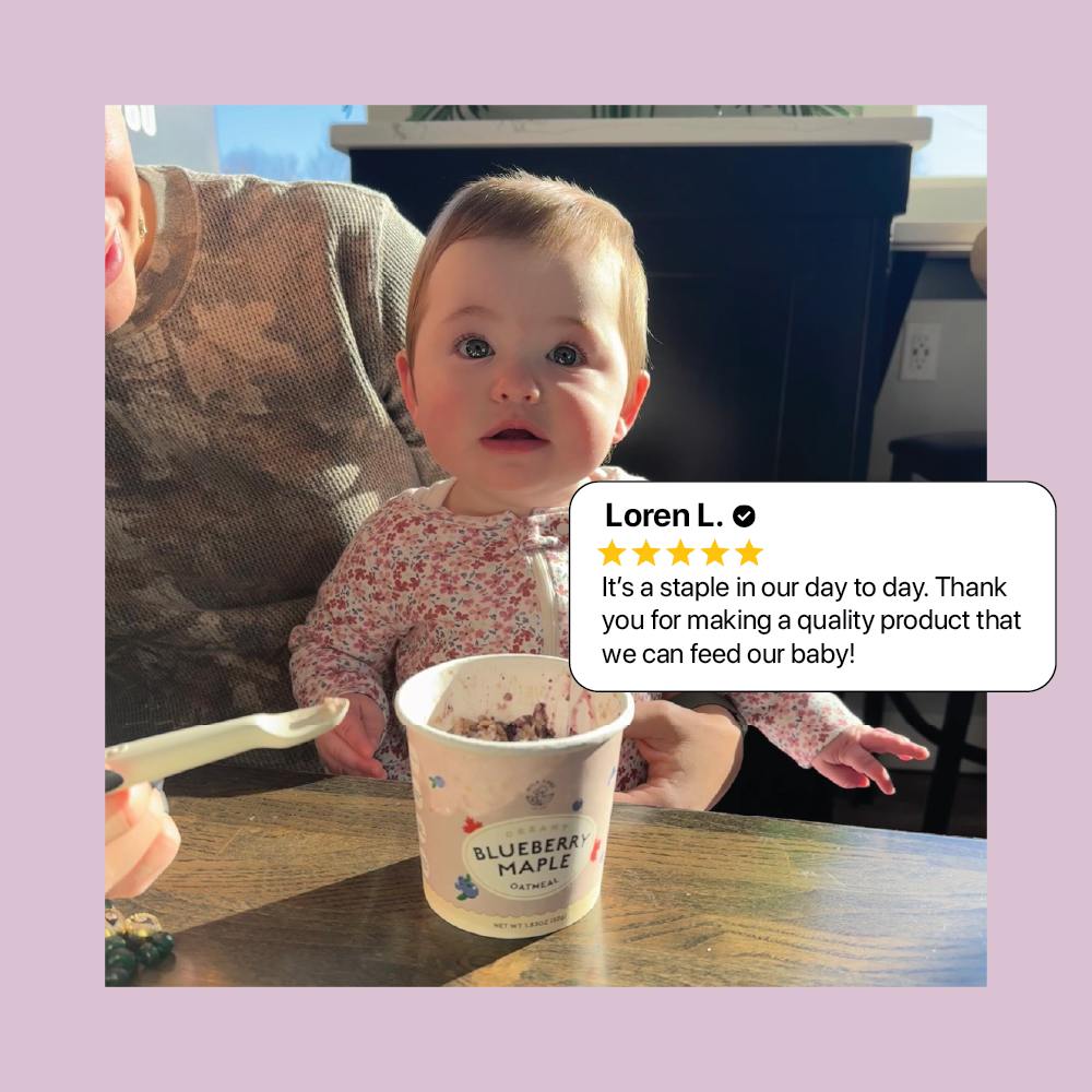 Baby with a container of blueberry maple oatmeal and a five-star review on a purple border