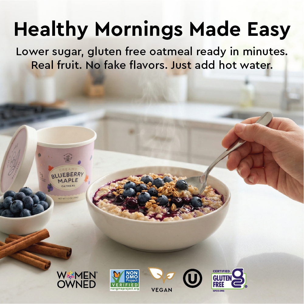 Oatmeal bowl with blueberries and a container of Blueberry Maple flavor on a kitchen counter.