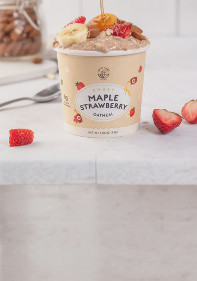 overflowing maple syrup in maple strawberry oatmeal cup